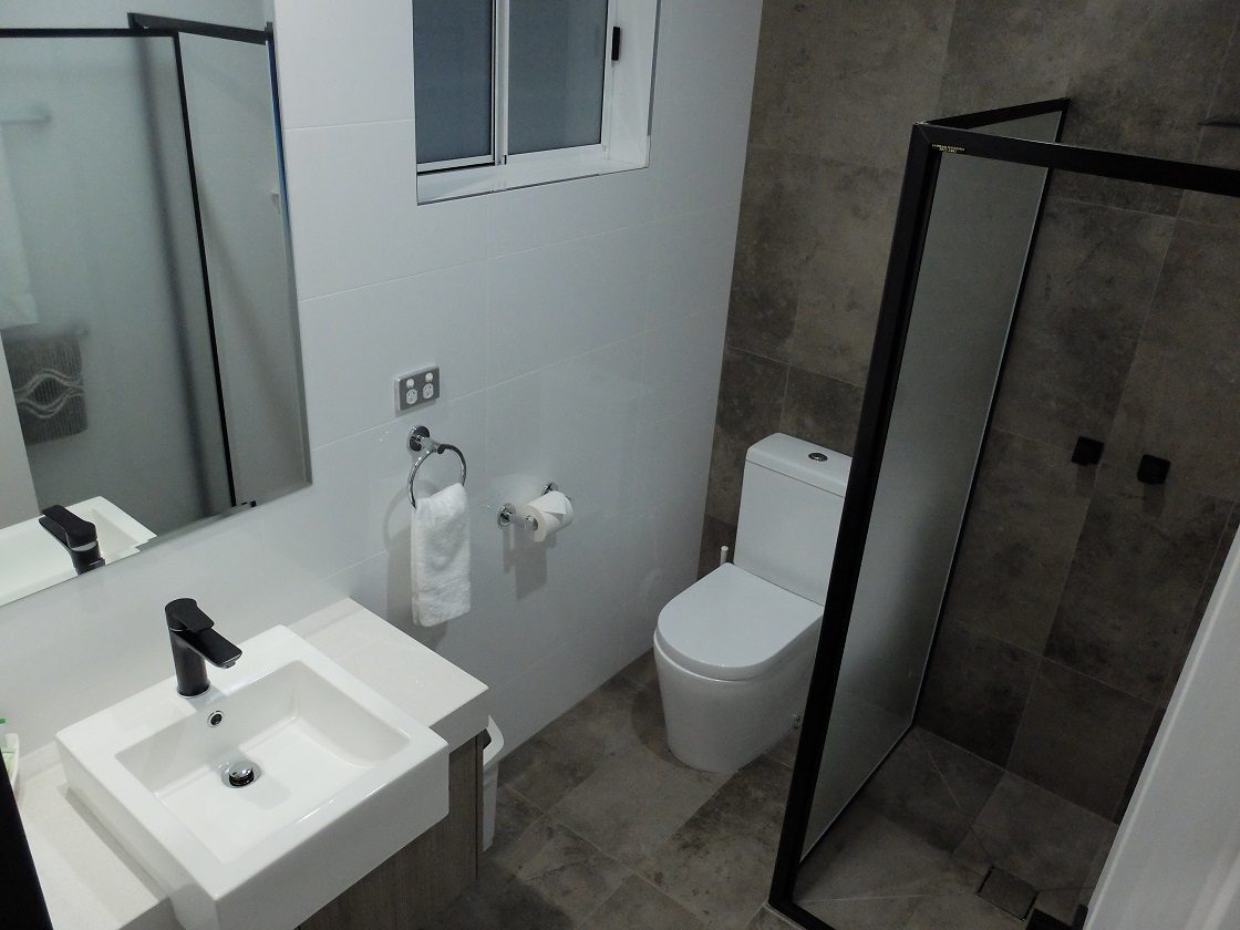 Deluxe Studio Apartment bathroom with walk-in shower