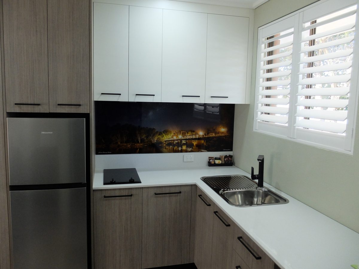 Studio Apartment overview showing beds and kitchen